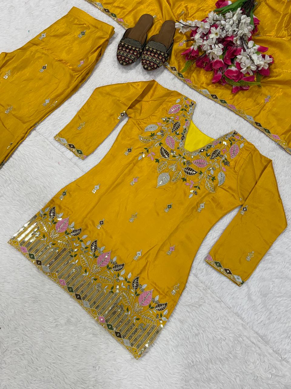 Elegant Rust Orange Silk Kurta and Flared Palazzo Set Adorned with Intricate Multicolored Botanical Embroidery and Mirror Work